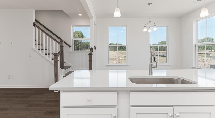 a kitchen with white cabinets